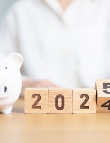 2024 end year to Happy New Year 2025 with piggy bank. Resolution, Goals, Plan, Action, Money Saving, Retirement fund, Pension, Investment and Financial concept